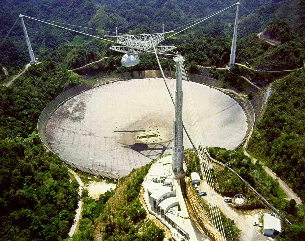 Some researchers want to use big radio dishes like the 305-meter Arecibo Observatory in Puerto Rico to announce our presence to intelligent aliens.