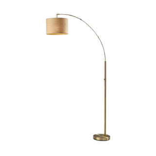 A arched floor lamp with a paper lampshade