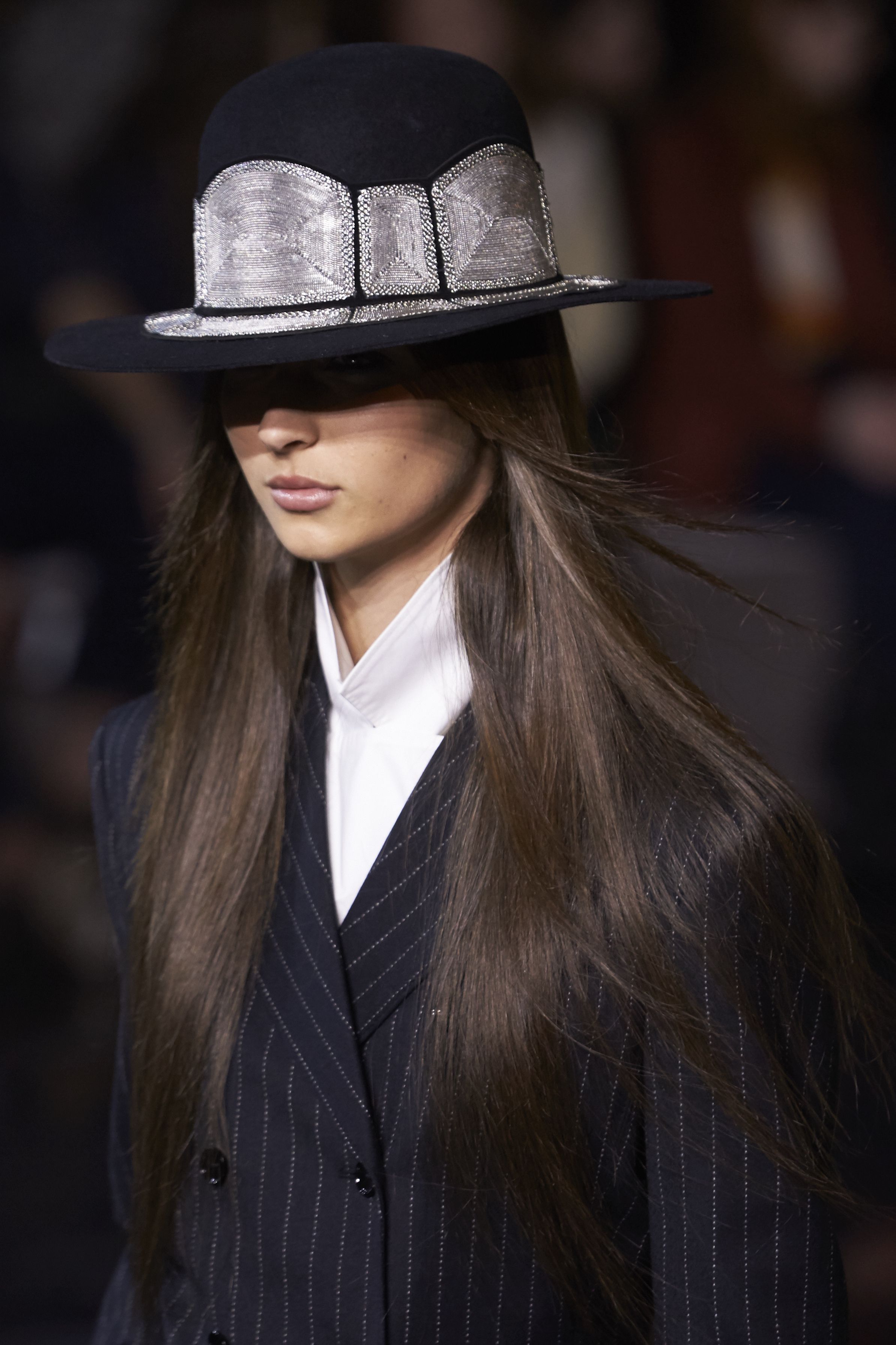 A model walks the runway wearing a suit.