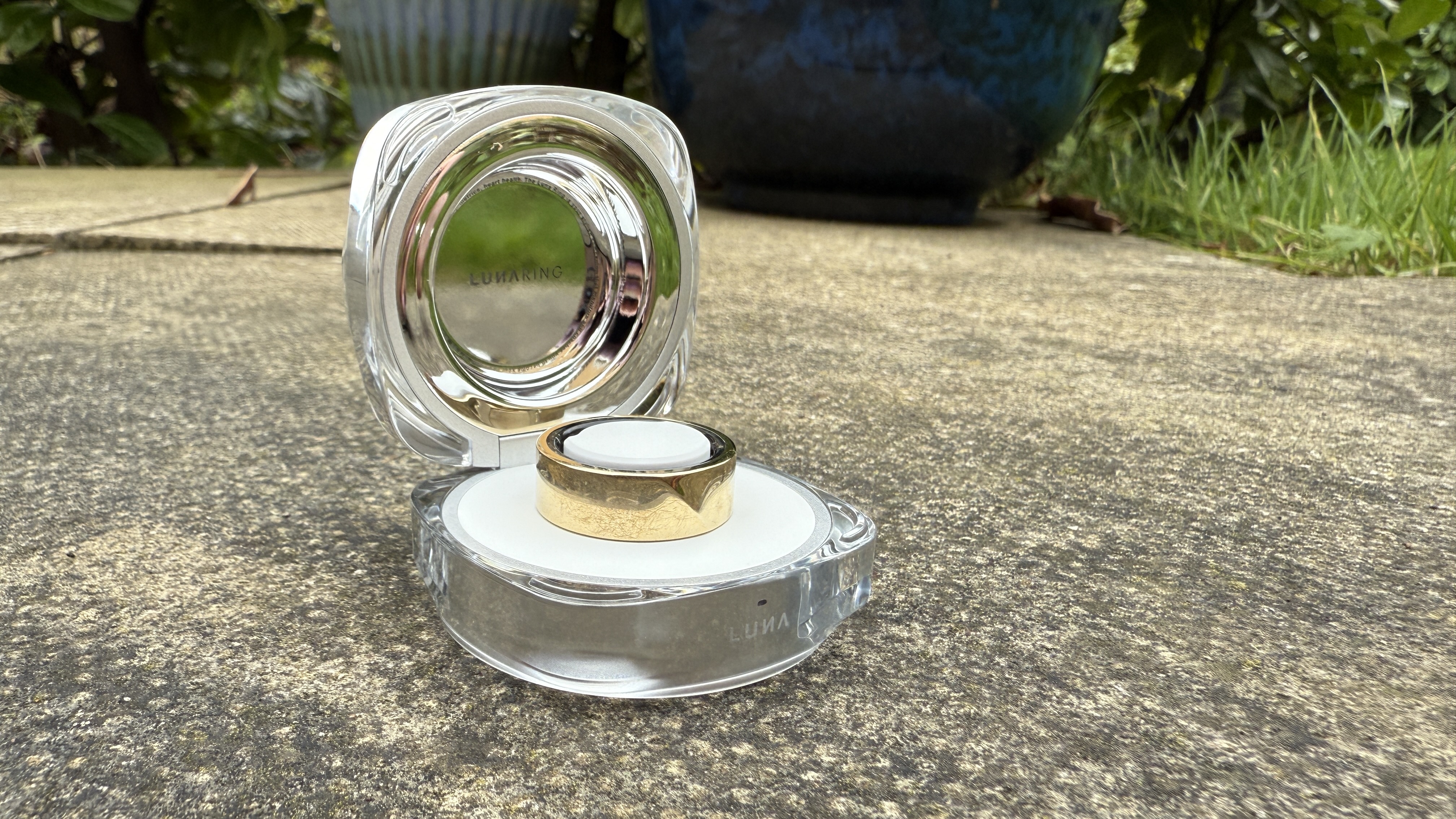 The Luna ring 2 in gold in its charging case