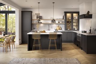 herringbone wood kitchen flooring with dark cabinets