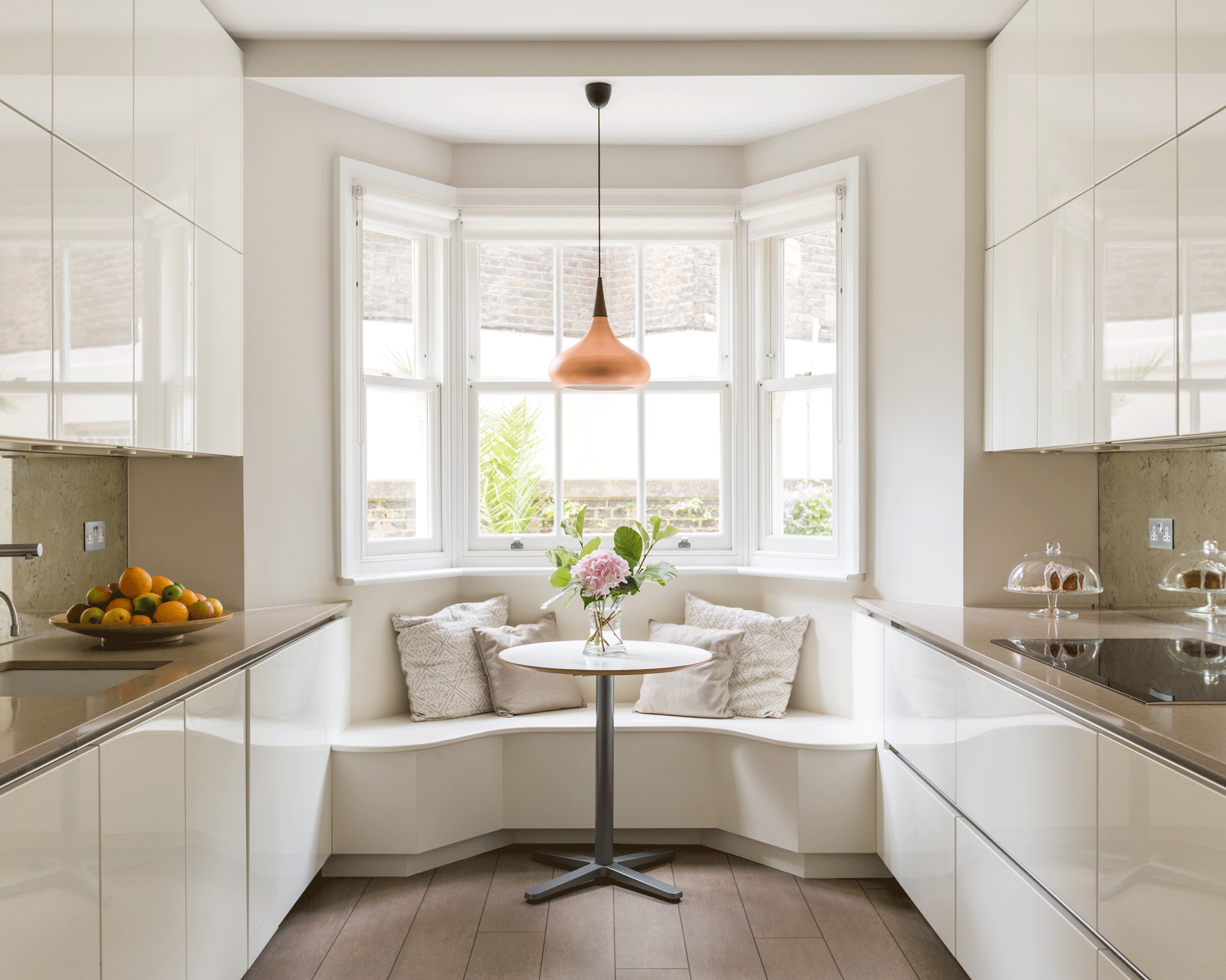 Kitchen with curved window seat dining hook