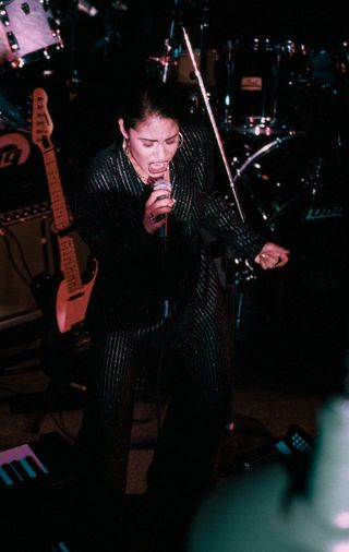 Singer Selena (Quintanilla) performs at the opening of the Hard Rock Cafe on January 12th, 1995 in San Antonio, Texas.
