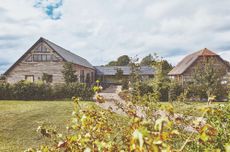 house exterior and driveway and wooden walls and garden 