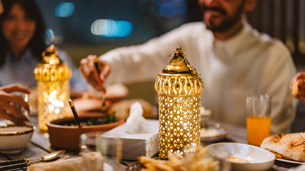 Muslims celebrating Eid together with a delicious feast of Middle Eastern food.