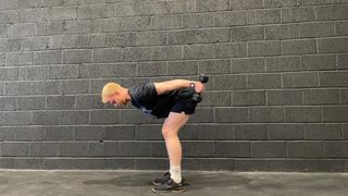 TechRadar fitness writer Harry Bullmore demonstrating a double dumbbell triceps kickback
