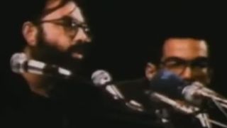 Close up of Francis Ford Coppola speaking into a microphone