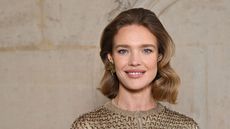 natalia vodianova on a beige background