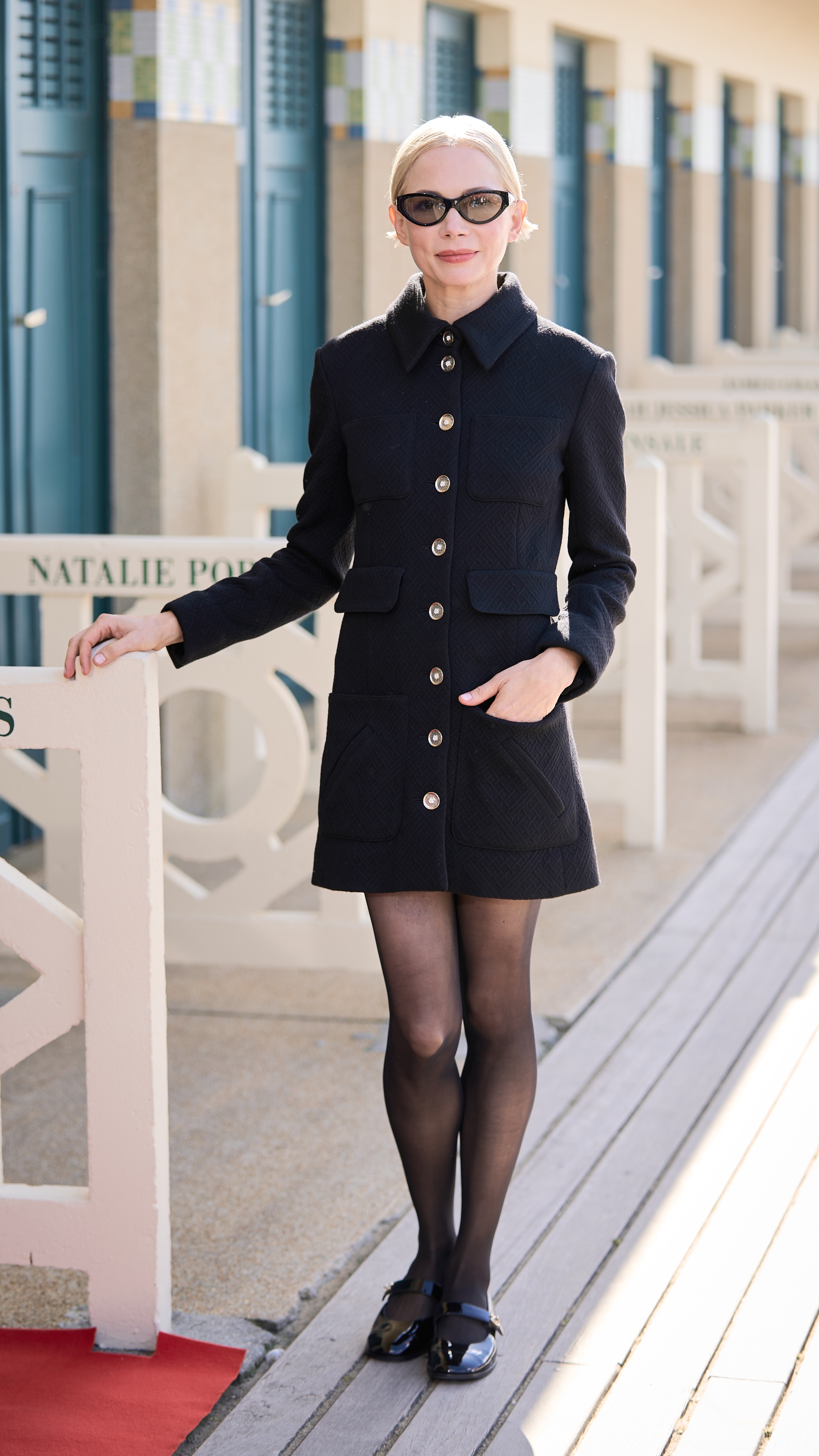 Michelle Williams poses during the unveiling of her dedicated beach locker room on the Promenade des Planches during the 50th Deauville American Film Festival on September 12, 2024 in Deauville, France.