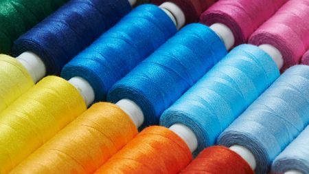 Rolls of brighlty-colored sewing thread. 