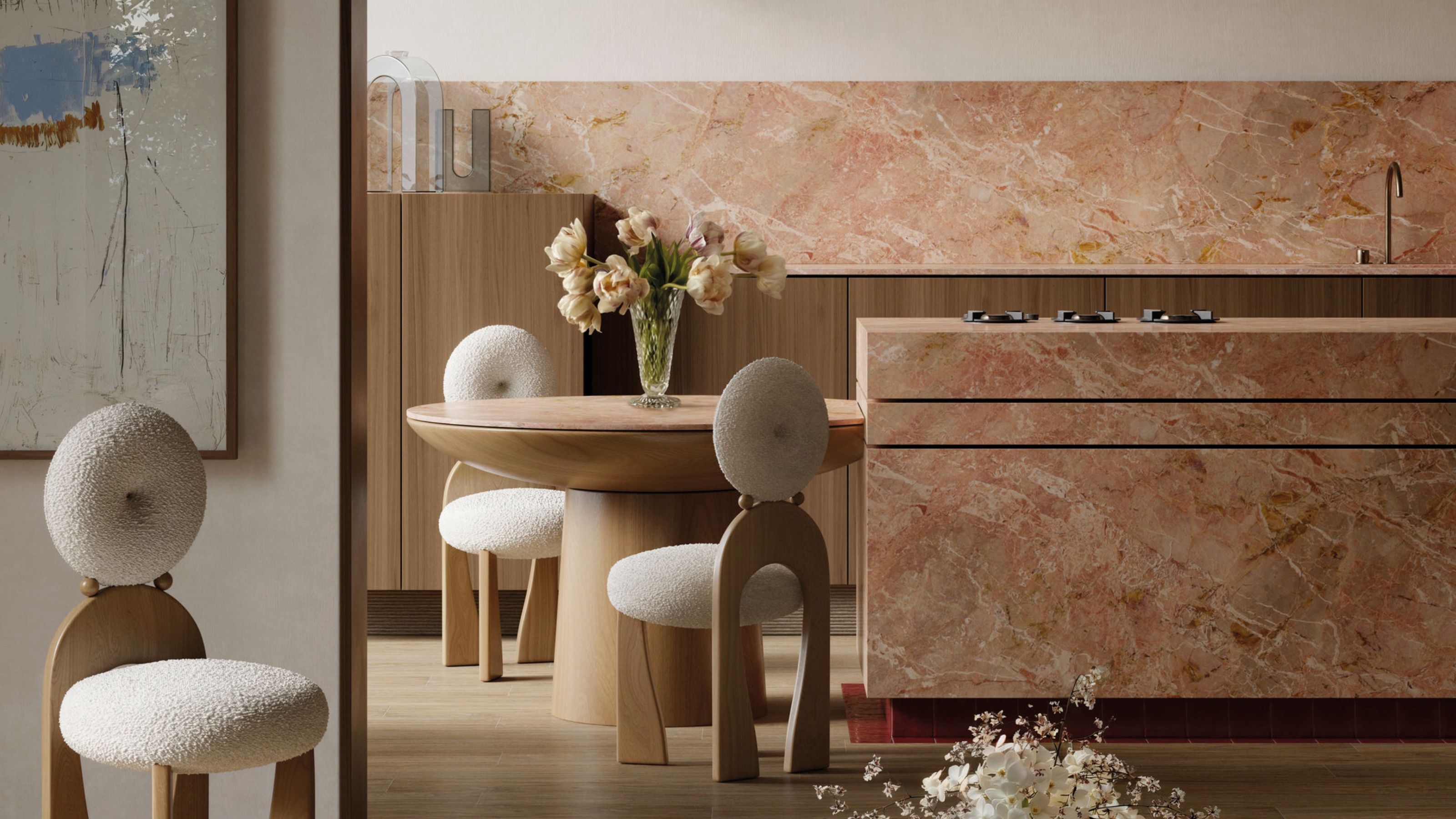 a kitchen with island and backsplash in pink stone