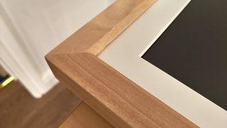 Vieunite Textura Digital Canvas review; a close up of a digital picture frame's wooden frame