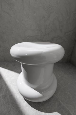 white round stool by VitrA and Tom Dixon