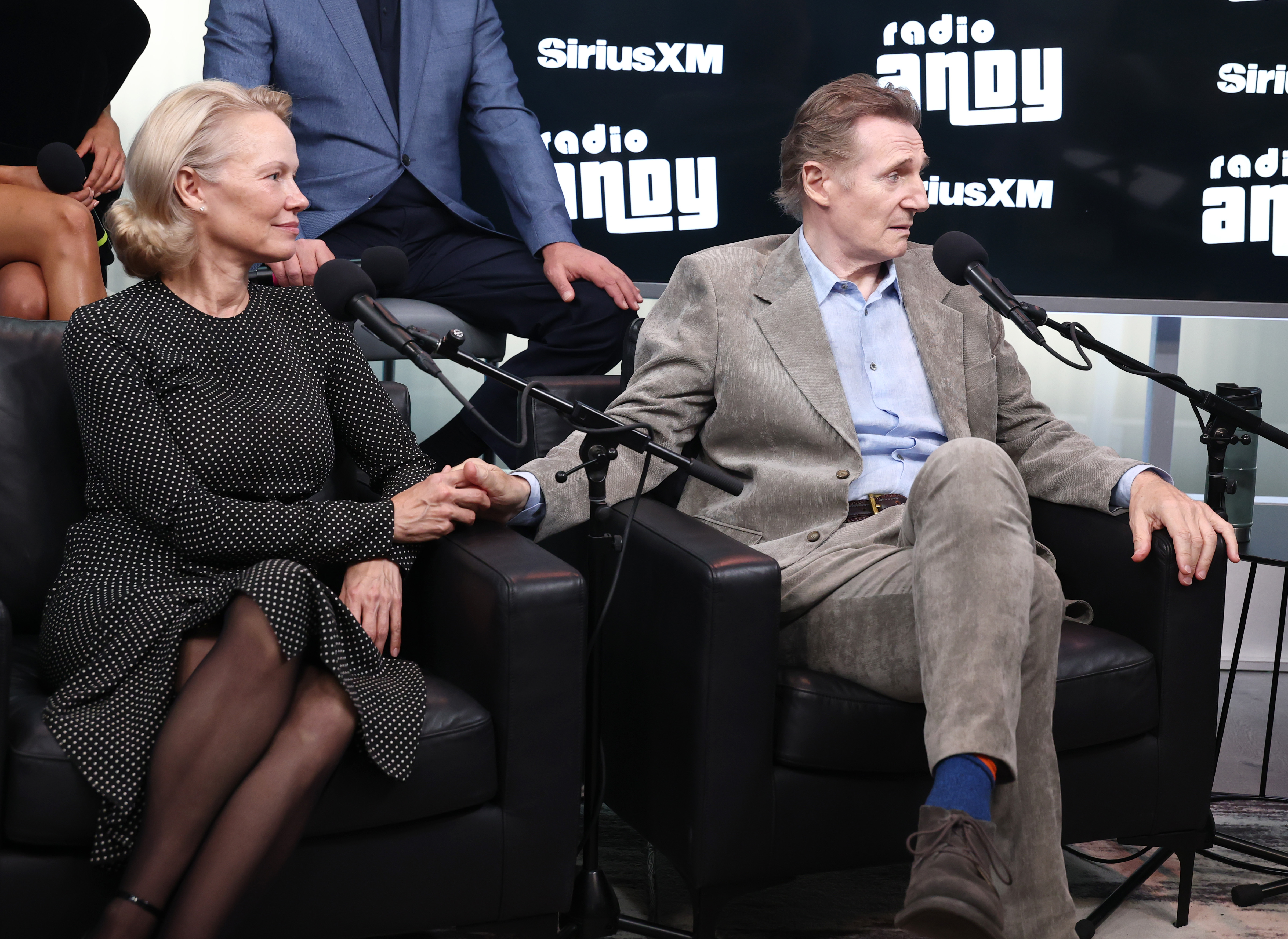 Pamela Anderson and Liam Neeson display PDA while promoting The Naked Gun