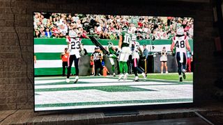 New England Patriots vs New York Jets playing on a TCL QM8 (2024)