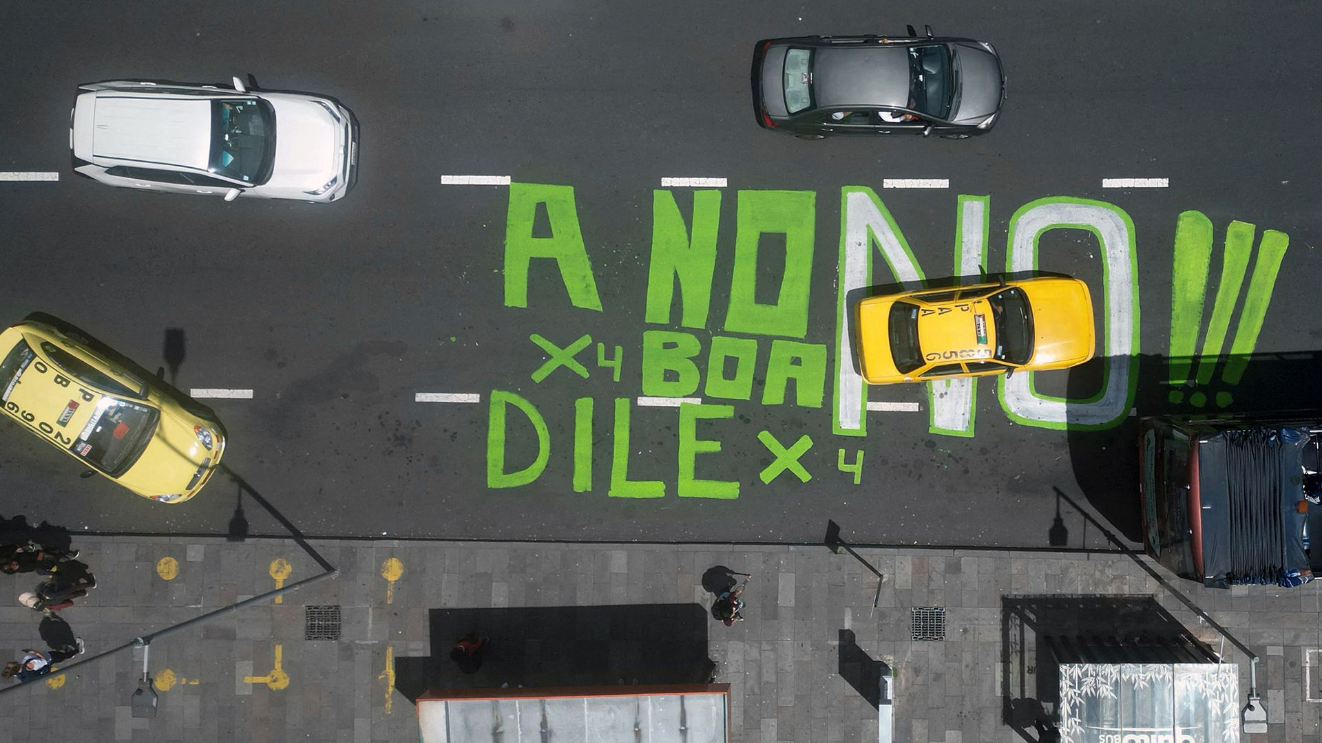 
                                An aerial view of graffiti protesting the upcoming referendum on foreign military bases, in Quito, Ecuador
                            