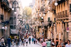 Crowded streets of Gothic Quarter on a sunny summer day, Barcelona, Spain