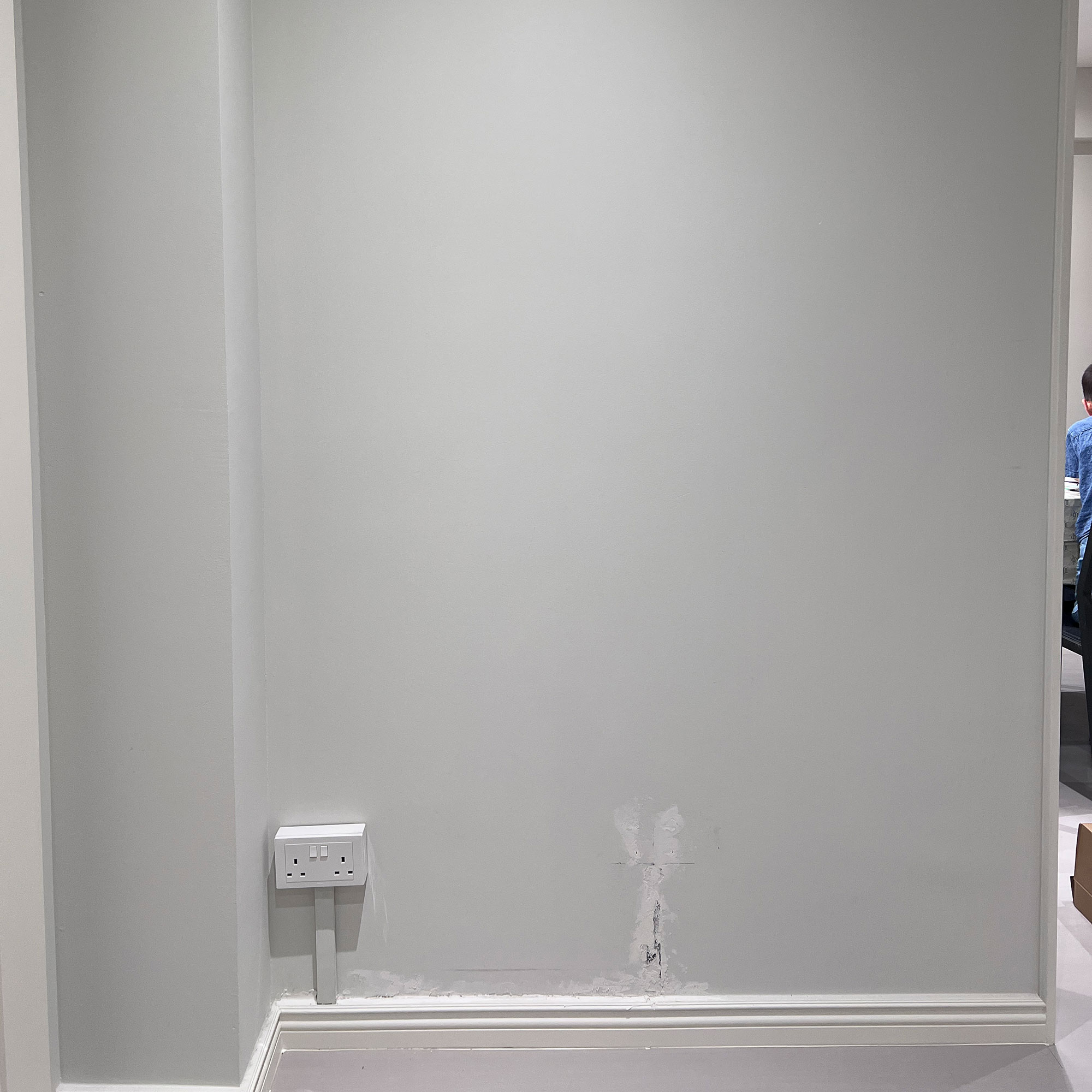 White wall of room with plug socket
