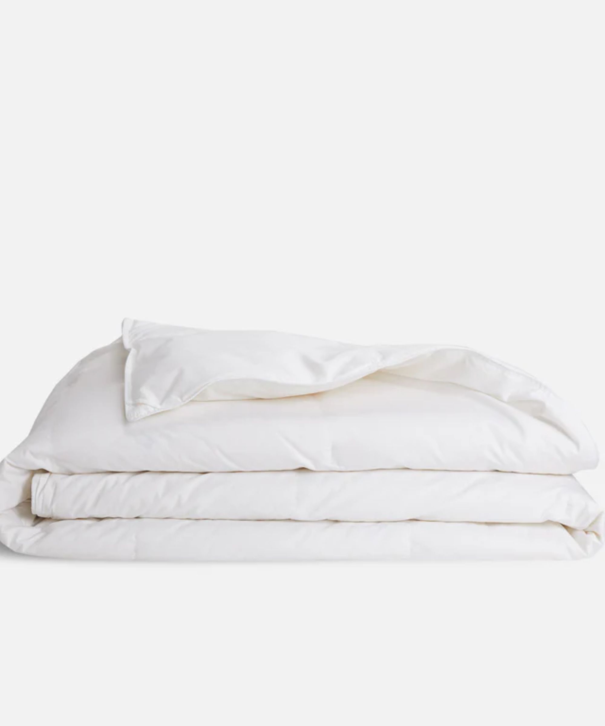 A white folded Brooklinen down alternative duvet