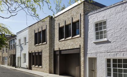 One townhouse and two mews houses, whose front facades were completely redesigned