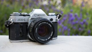 Canon AE-1 film SLR 3/4 front view