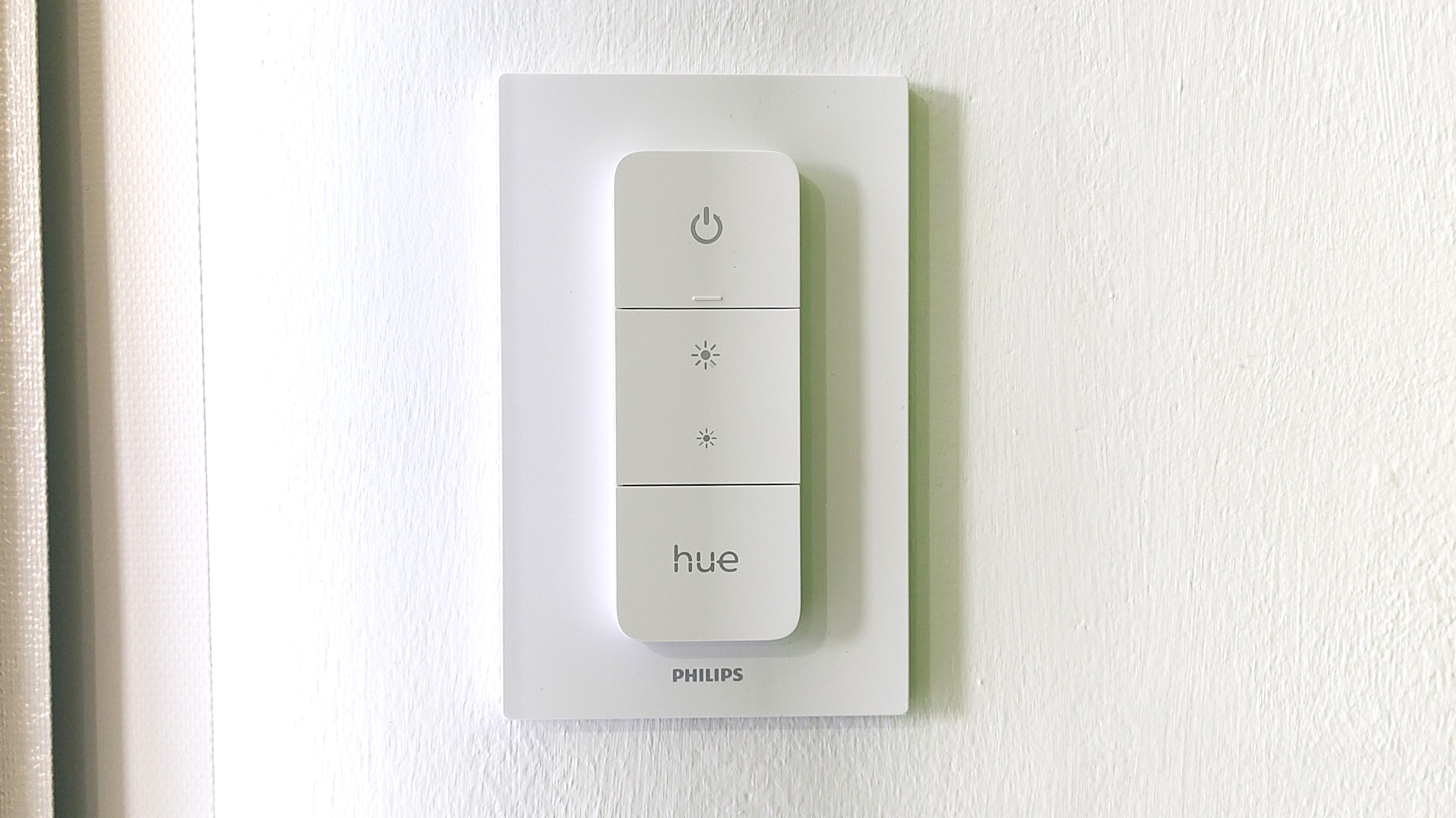 Philips Hue Dimmer Switch mounted on wall