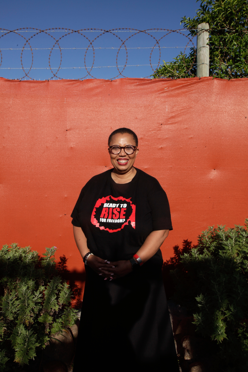 Lucinda Evans in her garden, the heart of Philisa Abafazi Bethu means 'Heal Our Women'