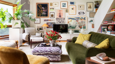 Ecclectic sun drenched living room featuring a zebra patterned ottoman and cozily upholstered sofas and chairs. The far wall features a credenza styled with various sculptural objects. Above, there is a gallery wall of assorted paintings and prints.