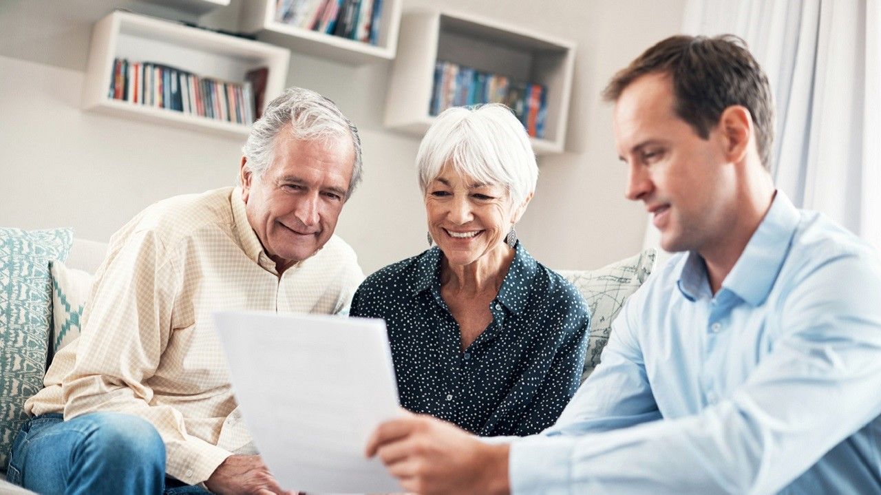 Shot of a senior couple getting advice from their financial consultant at home