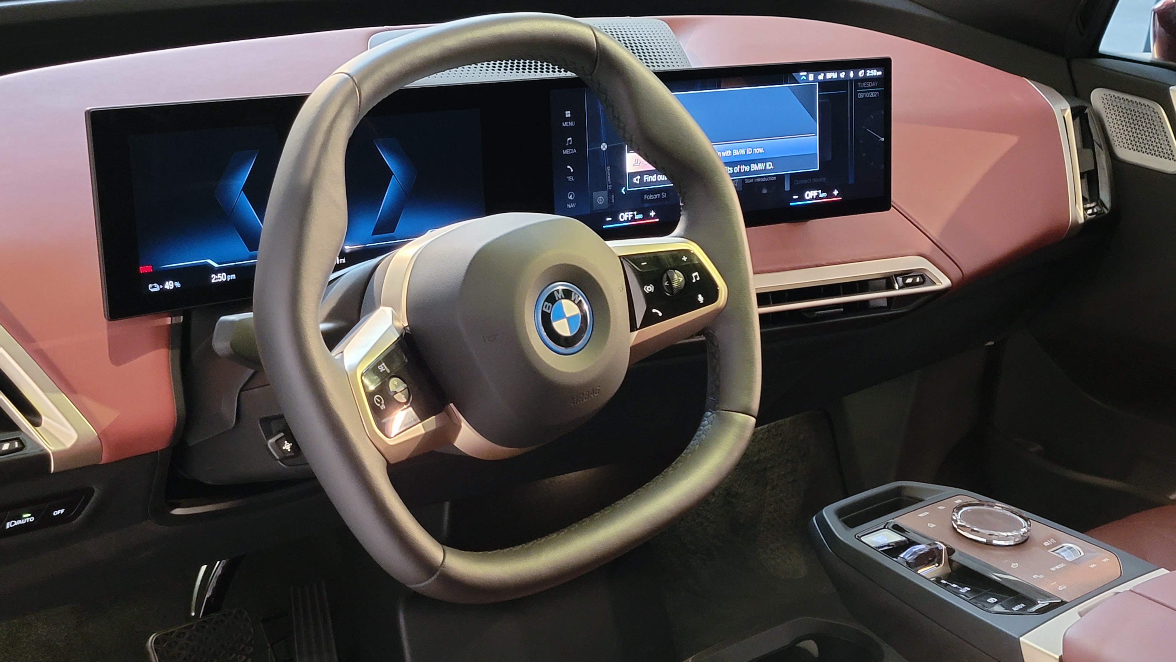 Close-up of steering wheel and displays in the BMW iX