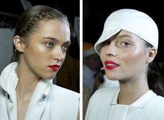 Two female models wearing highlighter and red lips