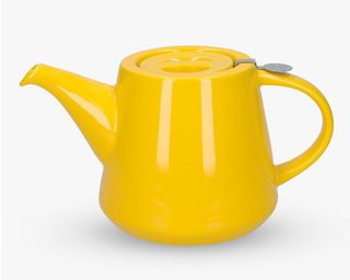 yellow teapot on white surface