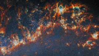 Red and orange streaks against a dark blue starry section of space.