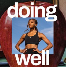 Gabby Thomas in a black sports bra with a colorful art treatment