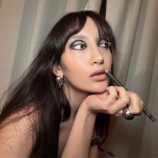 An image of WWW associate beauty editor Alyssa Brascia wearing the bleached brow trend. 