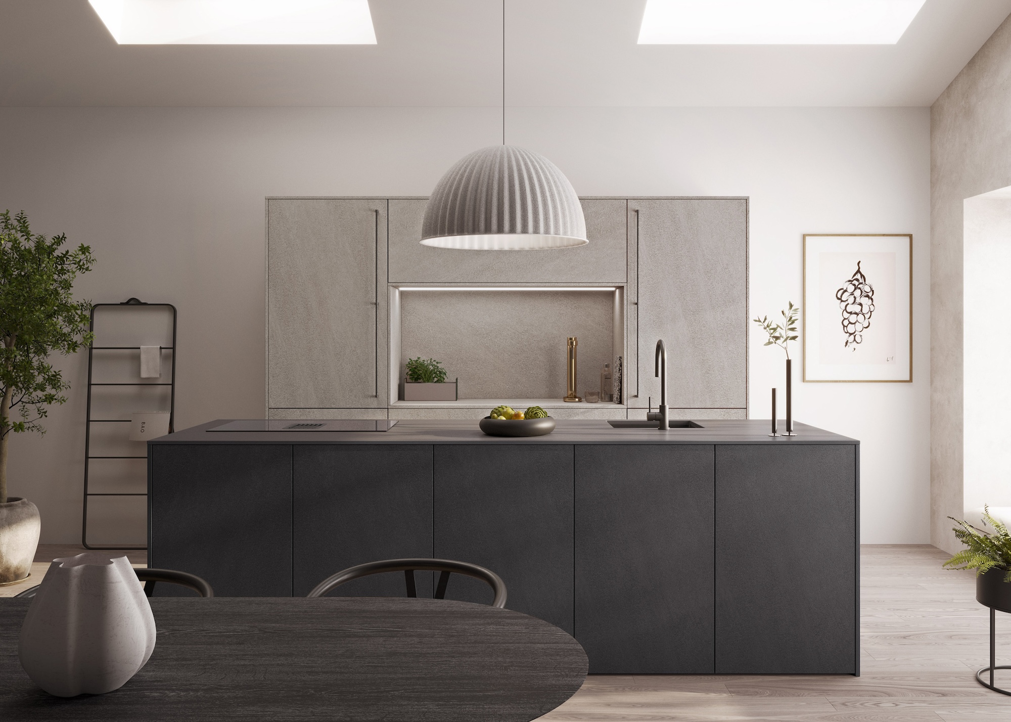 A grey kitchen with a large island in the middle as well as a pendant light hanging above the island. There is also a view of the grey colored dining table with a vase on top.