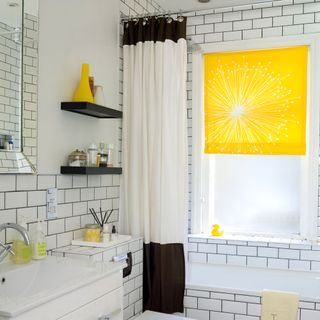 bathroom with white wall and yellow blinds and curtains and washbasin