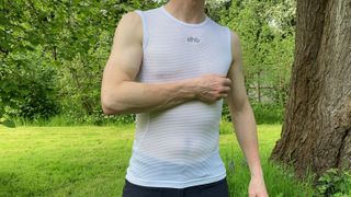 man wearing sleeveless summer base layer outside
