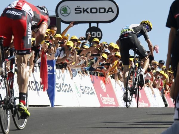 Froome looks back to see Evans distanced as the line approaches