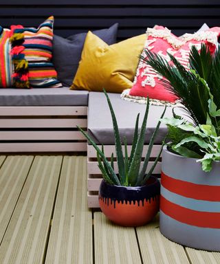 outdoor deck with sofa painted with cuprinol paint