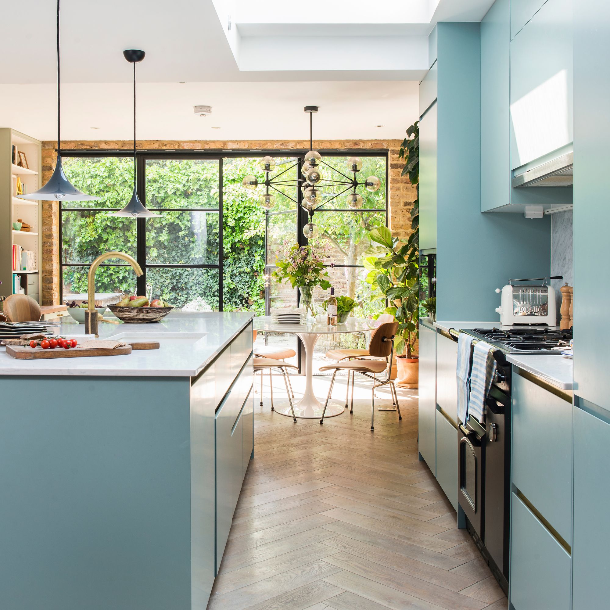 Kitchen with duck egg blue cabinets and large kitchen island