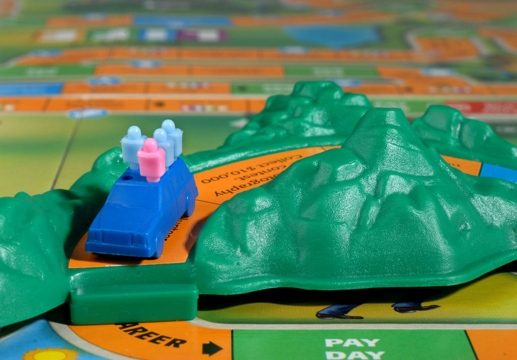 Close up of a blue car on a &quot;mountain&quot; in the Game of Life board game. Times Union staff photo by Lori Van Buren -- Life board game on February 15, 2007.