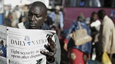 Kenyan reading newspaper