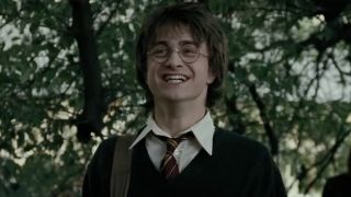 Daniel Radcliffe as Harry Potter laughing in The Goblet of Fire.