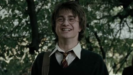 Daniel Radcliffe as Harry Potter laughing in The Goblet of Fire.