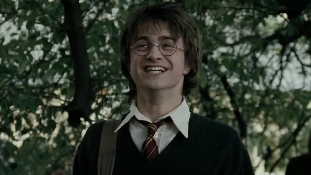 Daniel Radcliffe as Harry Potter laughing in The Goblet of Fire.