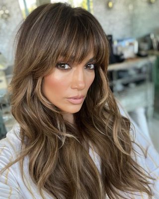 Jennifer Lopez with a shag haircut and bangs