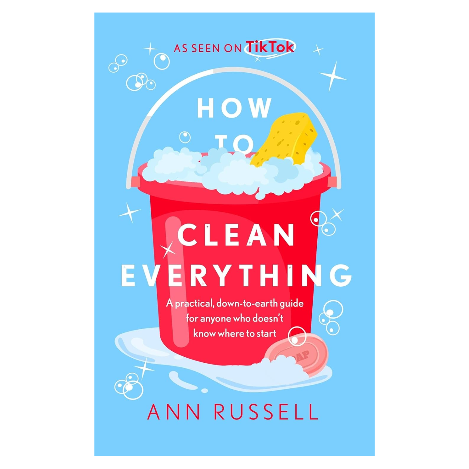 A paperback book front titled 'How to Clean Everything' by Ann Russell with an animated graphic of a red bucket with bubbles, soap and a sponge