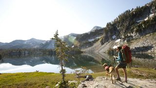 Woman hiking with her dog