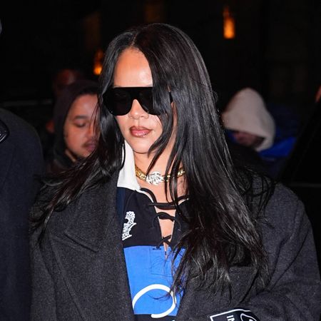 Rihanna revives 2025's rugby shirt trend, paired with layered jackets, white pointed-toe pumps, and Balenciaga pants